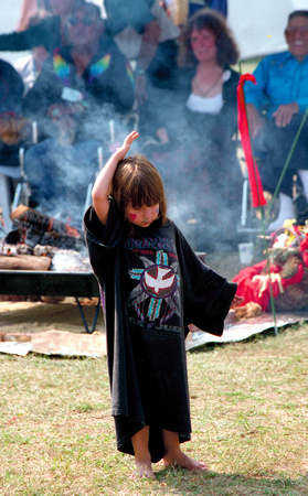 0110:  Little Girl Dancing for Peace in Front of Sacred Fire and Elders